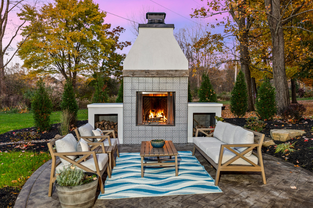 Exterior and outdoor fireplace renovation by PH Design, home builders in Canton, Ohio