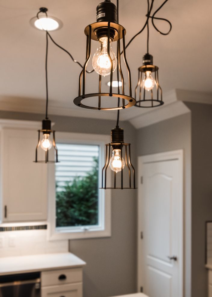 Light fixtures of Lakehouse Kitchen by PH Design, custom construction home builders in Canton, OH
