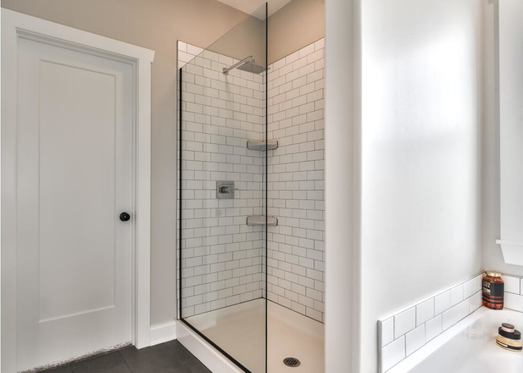 Tile shower of Ardbeg Traditional Farmhouse Home by PH Design, custom construction home builders in Canton, OH