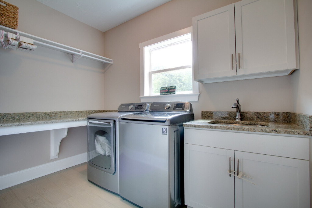 Laundry room of The Dalmore, colonial style home by PH Design, custom construction home builders in Canton, OH