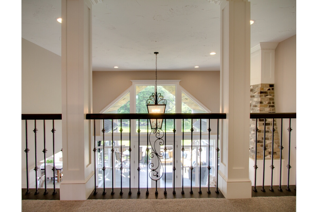 Upstairs walkway of The Dalmore, colonial style home by PH Design, custom construction home builders in Canton, OH