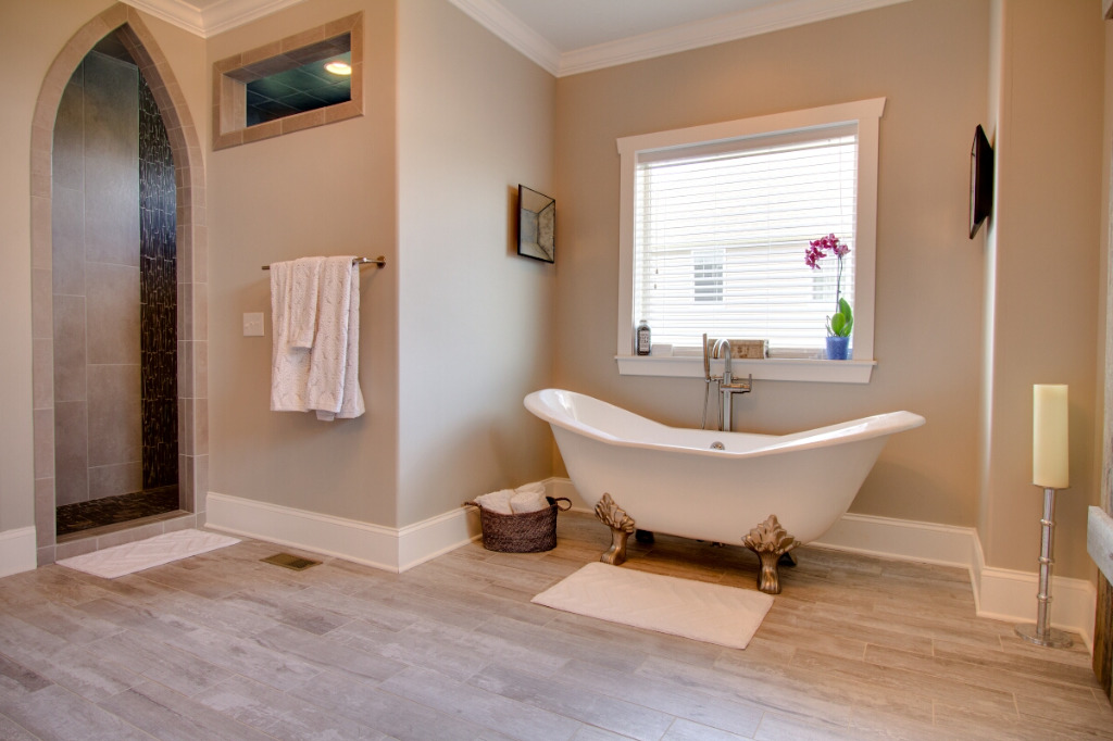 Bathroom with tub of The Dalmore, colonial style home by PH Design, custom construction home builders in Canton, OH