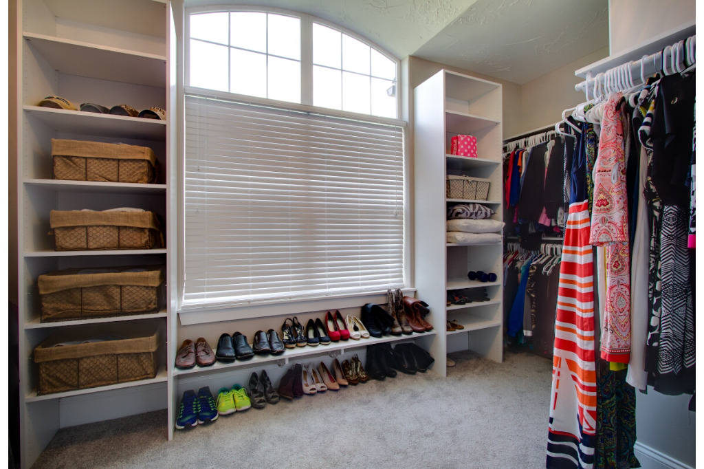 Walk-in closet of The Dalmore, colonial style home by PH Design, custom construction home builders in Canton, OH