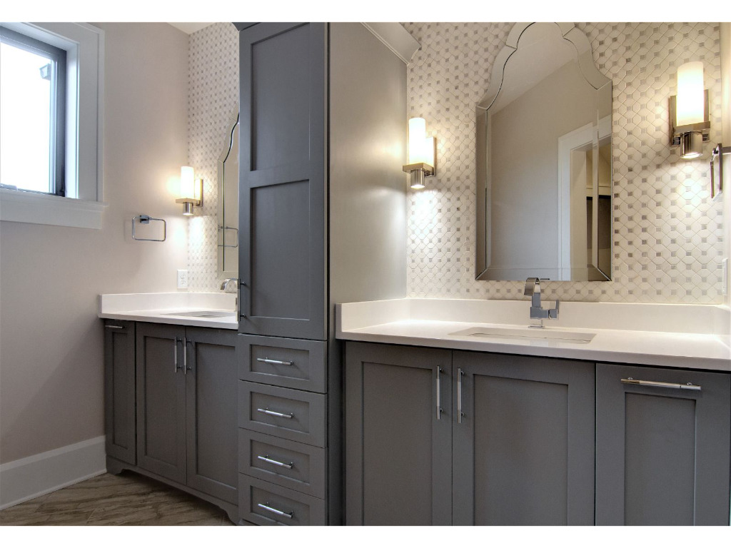 His and her bathroom of Woodford, tudor style home by PH Design, custom construction home builders in Canton, OH