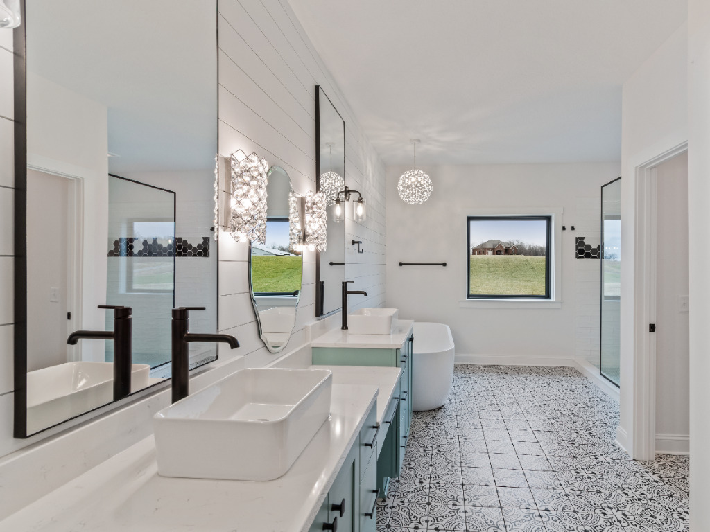 Modern bathroom with rectangular vessel sinks, bathtub, and shower with glass door of Modern Farmhouse Home by PH Design, custom construction home builders in Canton, OH
