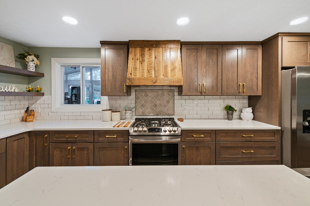 Eclectic Kitchen renovation with wooden cabinetry and tile backsplash by PH Design, custom construction and renovation company in Canton, OH
