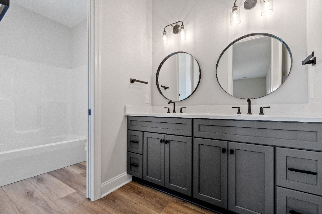 Full bathroom on the second floor with side-by-side vanities