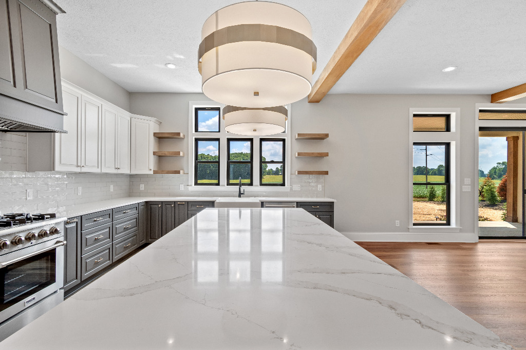 Kitchen view with large quartz island